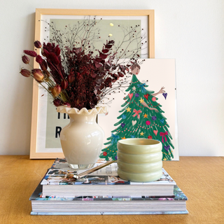 Cozy Winter dried flower arrangement in bordeaux and burgundy in a gloss milk-glass ruffle vase